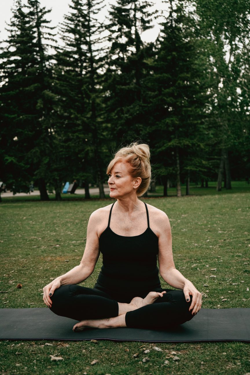 A lady over 50 doing a yoga position